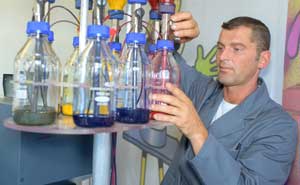 Chemist mixing paint - an introduction to titanium dioxide in the UL Knowledge Center
