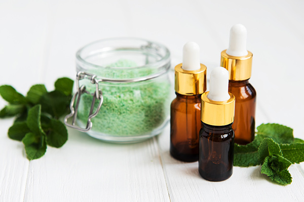 Essential aroma oil with massage salt and mint stock