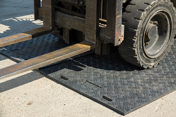 Photo of Ekomats with a forklift- Learn about using waste to create plastic products