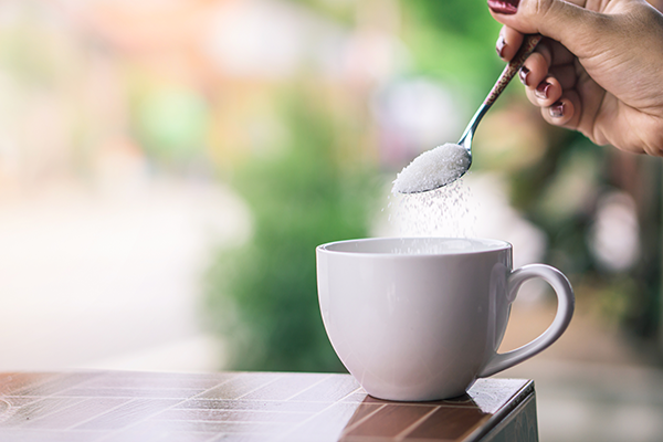 Sugar being added to coffee - Learn about anti-caking agents