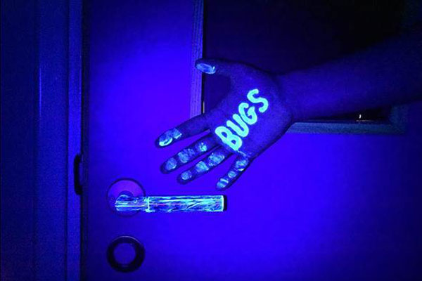 Germs under a blacklight - Learn more about plastics in PPE