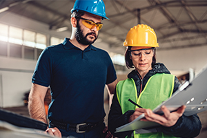 Quality Control Process Inspector writing a report