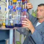 Chemist mixing paint - an introduction to titanium dioxide in the UL Prospector Knowledge Center