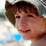 Boy wearing sunscreen - learn about formulating sunscreens with metal oxides in the Prospector Knowledge Center.