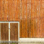 Image of weathered barn and doors - learn how to evaluate coating testing in the Prospector Knowledge Center.