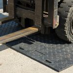 Photo of Ekomats with a forklift- Learn about using waste to create plastic products