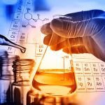 Hand holding a beaker - Curing bio-epoxies