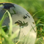 Model earth in the grass