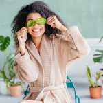 Woman with leaves over her eyes