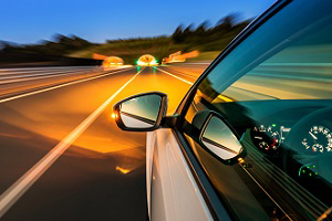 Car on a highway at night