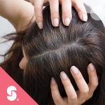 Top of a woman's head, Stepan logo