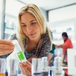 person looking at skincare products