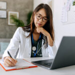 Woman writing at desk