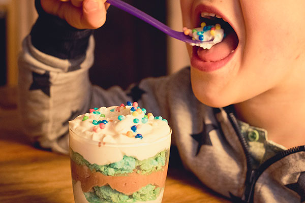 Child eating pudding - learn how food additives like stabilizers, food thickeners, & gelling agents work, and their food applications in the Prospector Knowledge Center.