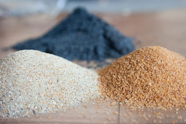 Piles of silicate sand - learn about waterborne silicate coatings in the Prospector Knowledge Center.