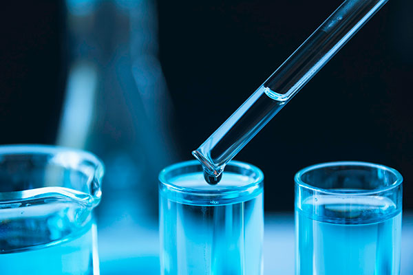 photo of test tubes and dropper in a lab setting - Learn more about smart coatings