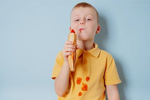Boy with stains on shirt