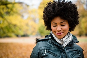 Smiling woman in autumn park