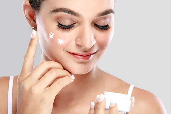 Person using facial cream