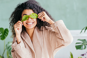 Woman with leaves over her eyes