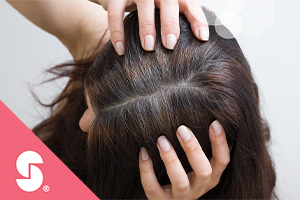 Top of a woman's head, Stepan logo