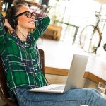 Woman on laptop - learn about the effect of artificial visible light (AVL) on skin in the Prospector Knowledge Center.