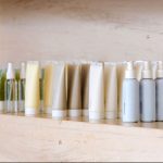 Group of variable skin care container products from natural ingredients on marble shelf - Learn about fatty alcohols in personal care products