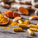 photo of turmeric in powder and pill form - learn more about the benefits of turmeric
