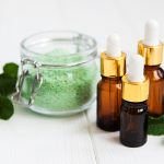 Essential aroma oil with massage salt and mint stock