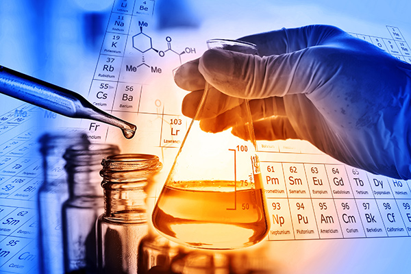 Hand holding a beaker - Curing bio-epoxies