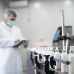 Laboratory worker on a cosmetic production line - Learn more about scaling up