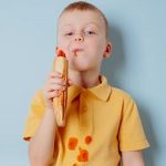 Boy with stains on shirt