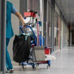 Person with cleaning cart