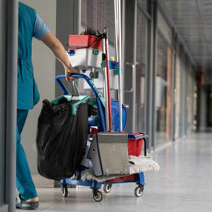 Person with cleaning cart