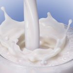 milk splashing into a glass