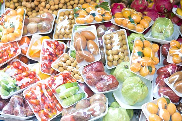 different food covered with cellophane