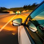 Car on a highway at night