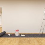 varnished wood floor in a room that is prepared for wall painting