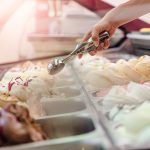 A person serving ice cream.