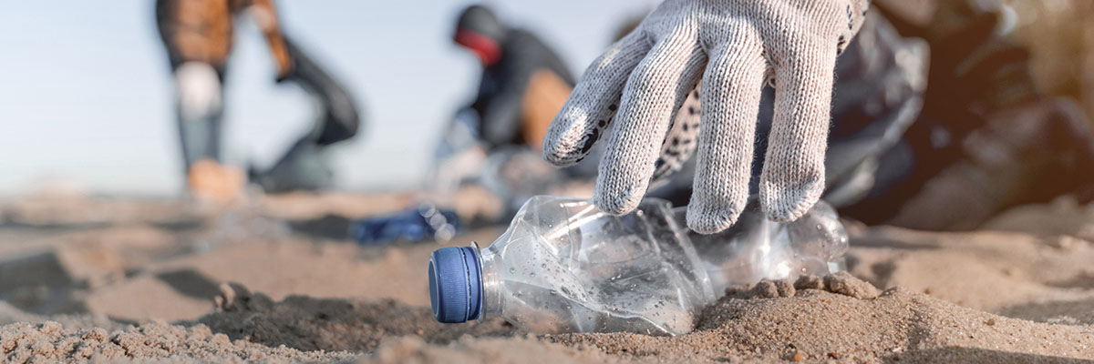 Picking up bottles on the beach
