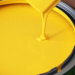 Yellow paint being poured