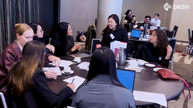 Screencap of formulators at a conference