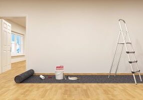 varnished wood floor in a room that is prepared for wall painting