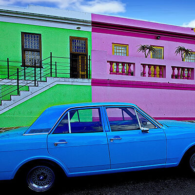 iStock-1193930563-brightly-painted-car-and-buildings-HEADER-600x400