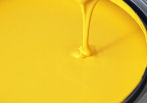 Yellow paint being poured